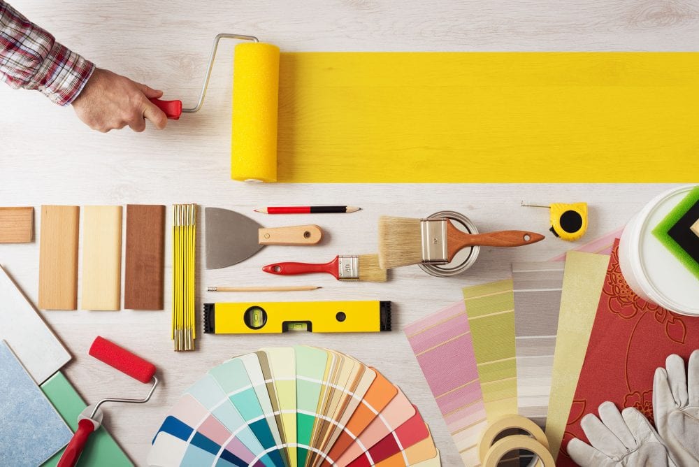 6 Quick Fix Ideas to Increase Your Property Value Graphic to show decorator holding a painting roller and painting a wooden surface, work tools and swatches at bottom, banner with copy space